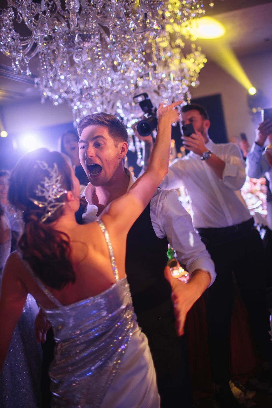 Party scene with sparkling crystal decorations and yellow spotlight effects.