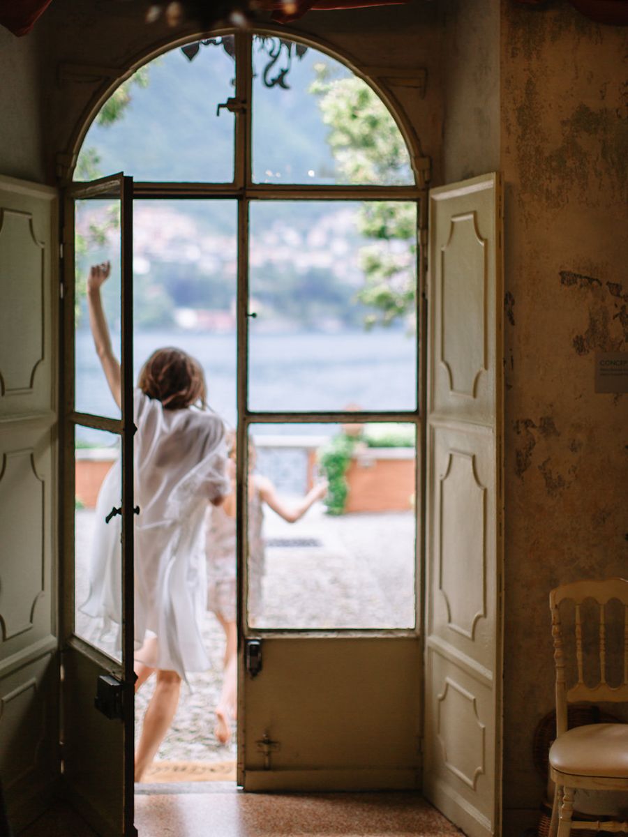 A sequence of photos showing a figure in white moving through an old abandoned room with large windows and natural light.