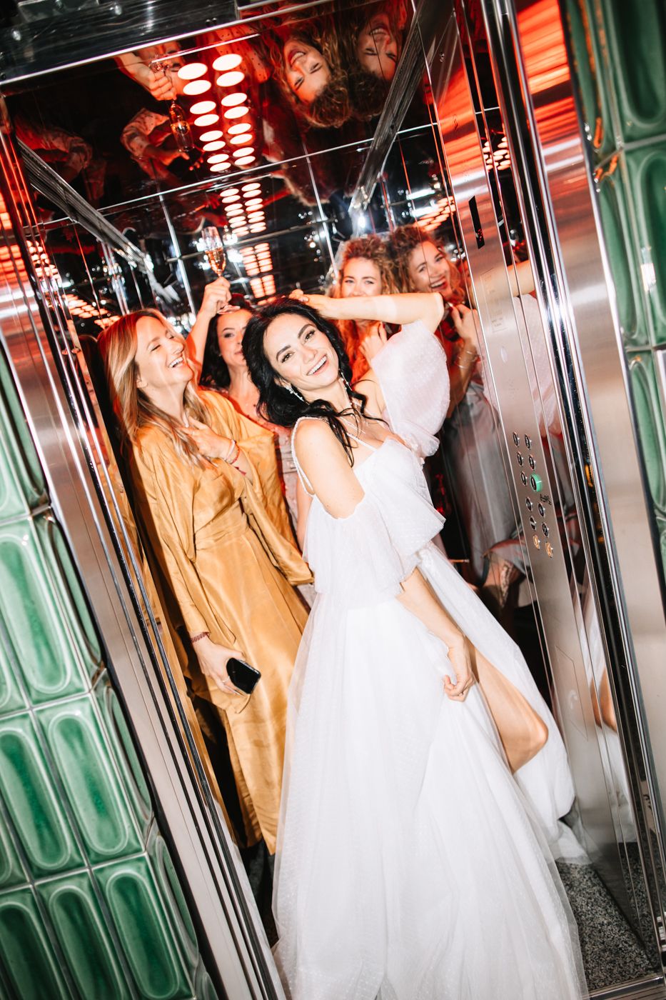 Multiple artistic photos of a bride in a white wedding dress posing inside an elevator with dramatic lighting effects.