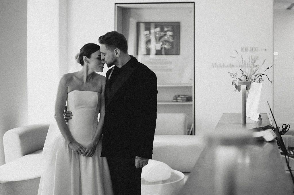A black and white wedding photo montage showing intimate moments between a couple on their special day.