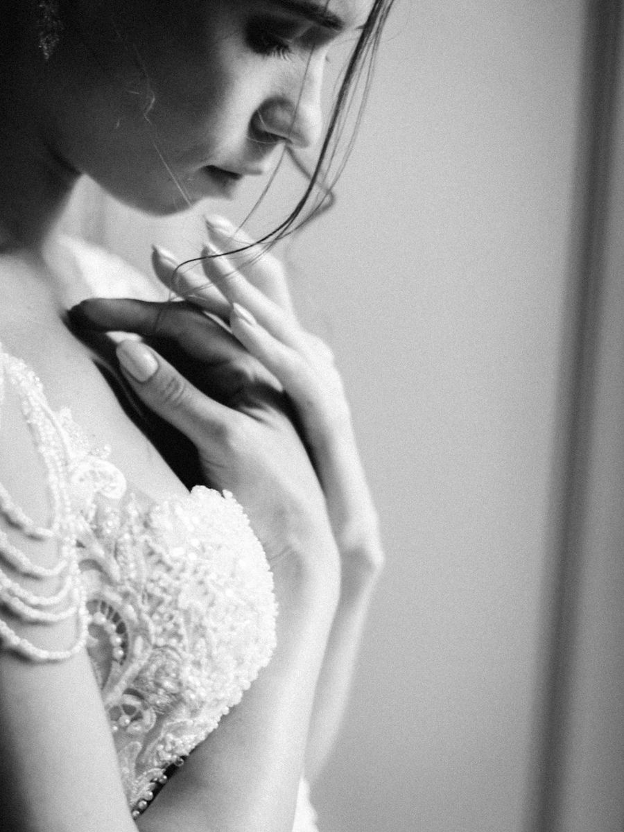 A series of black and white artistic bridal portraits showing delicate lace details and romantic side profile poses.
