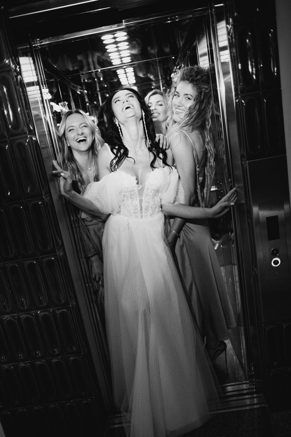 Black and white photo series showing a person in a white dress posing playfully in a mirrored room.