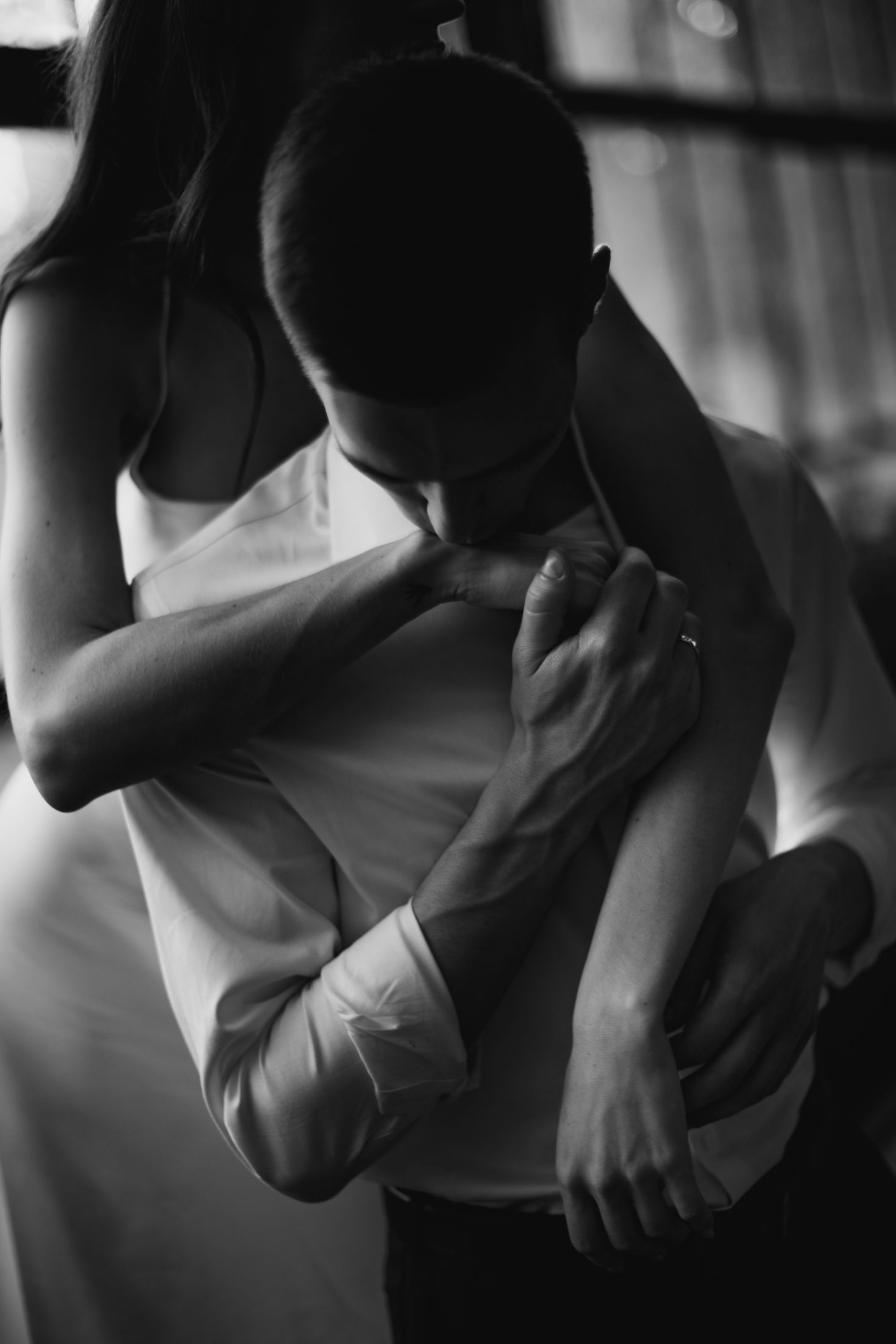 Black and white artistic photo series showing intimate dance movements and body positions in dramatic lighting.