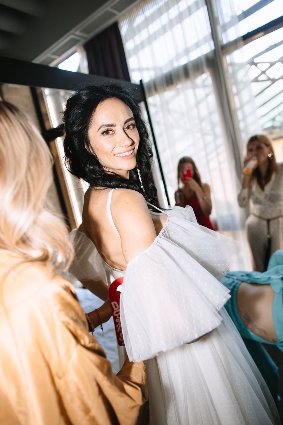 A sequence of candid moments captured in a bright sunlit room with soft natural lighting.