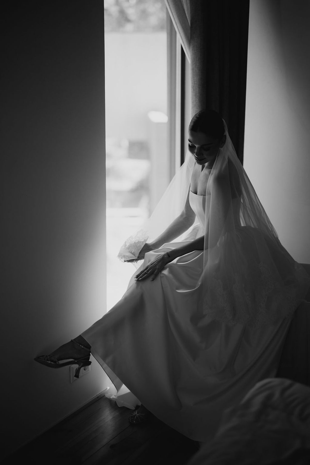 A series of moody black and white photos showing a ghost-like figure draped in white fabric creating an eerie atmosphere.