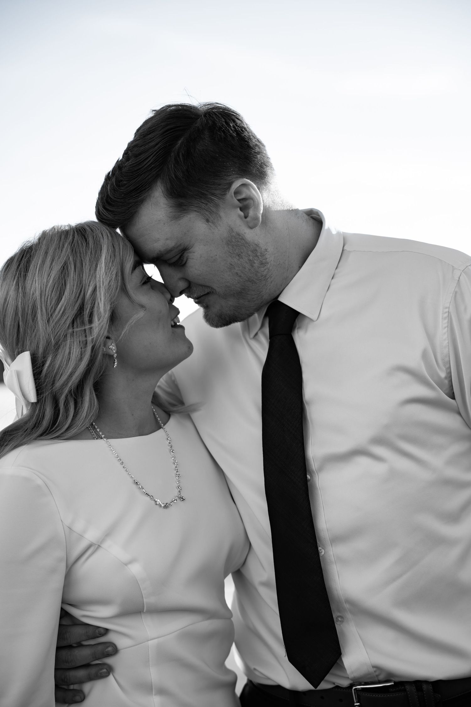 Romantic black and white portrait series showing intimate moments between a couple.