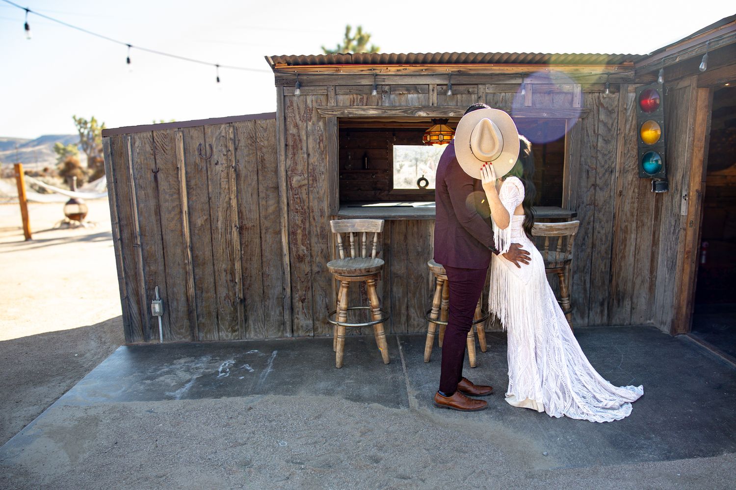 Rustic barn interior with wooden walls and natural lighting for a wedding venue.