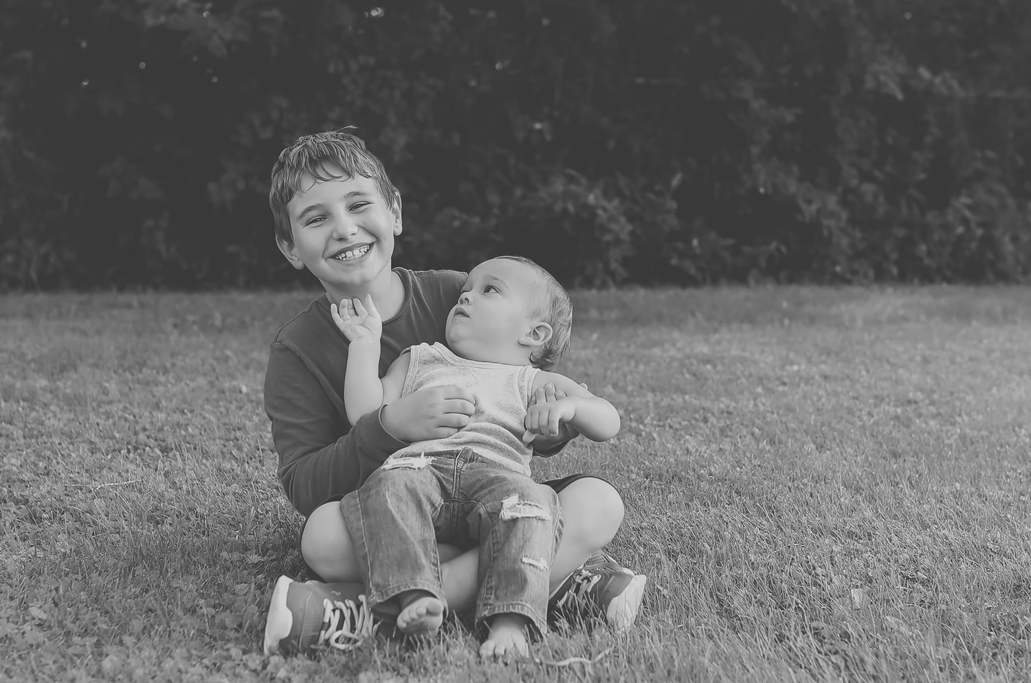 Black and white portrait session showing joyful expressions and laughter.