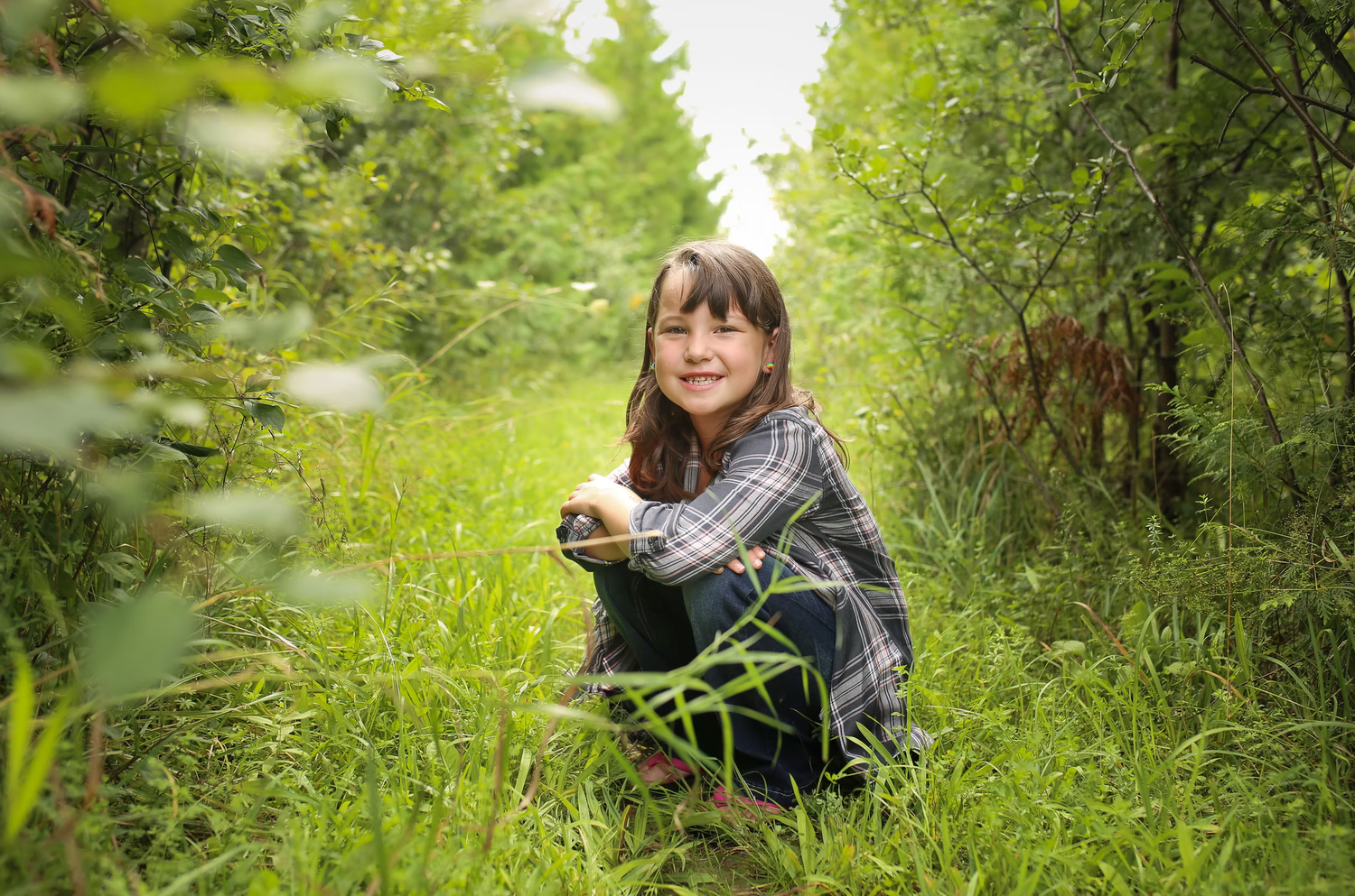Outdoor photography session in a lush green garden setting.