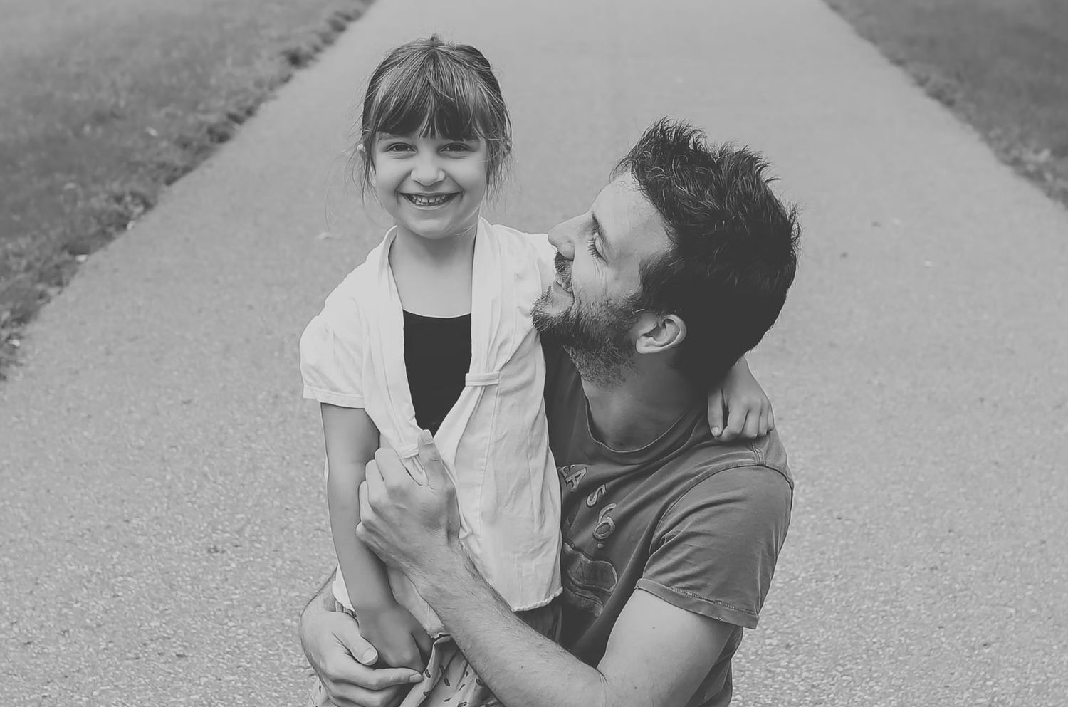Black and white candid moments captured during outdoor photo session.