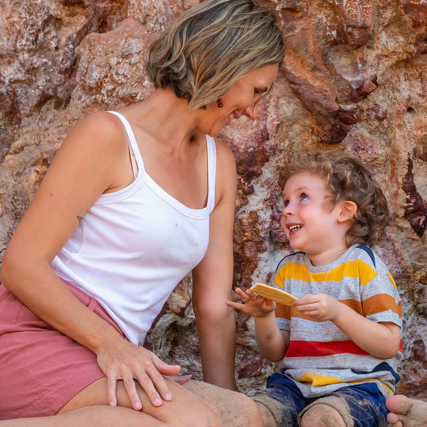 Mum and young boy talking together. Leigh Ball documentary family photographer