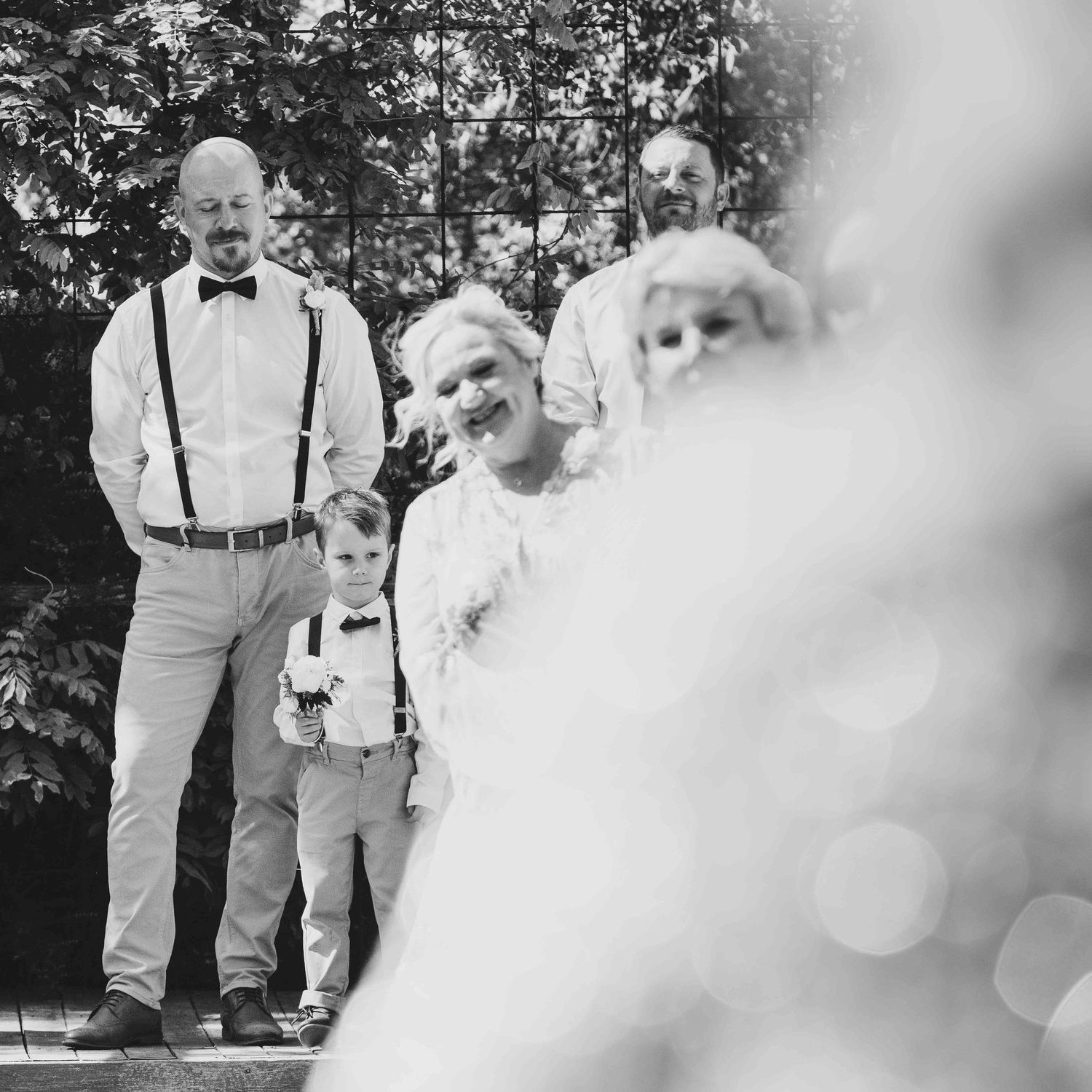 Leigh Ball Photography. Macedon Ranges over shoulder of bride groom is emotional as she walks down the aisle.