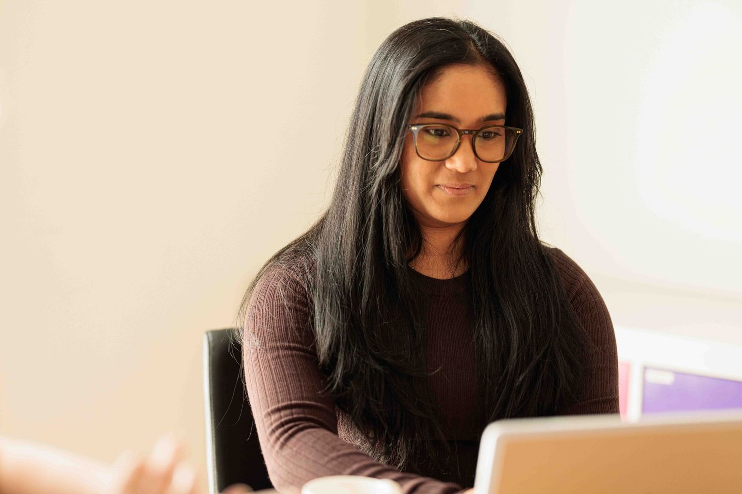 young woman working at laptop