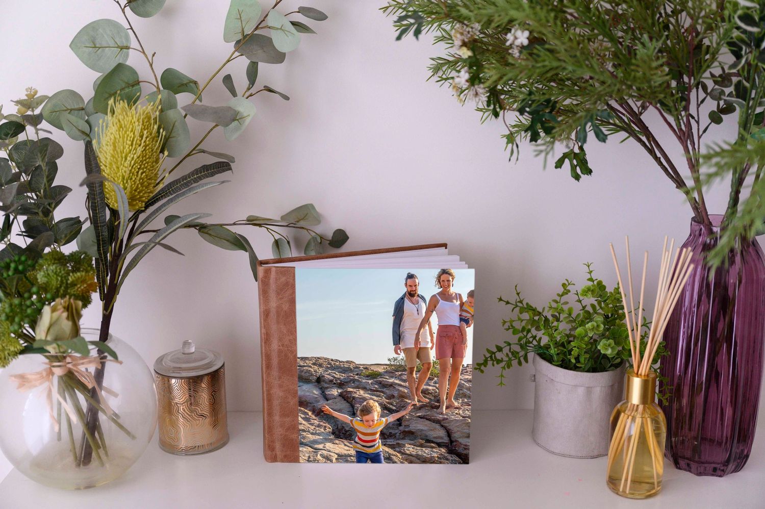 Photo album resting on sideboard.