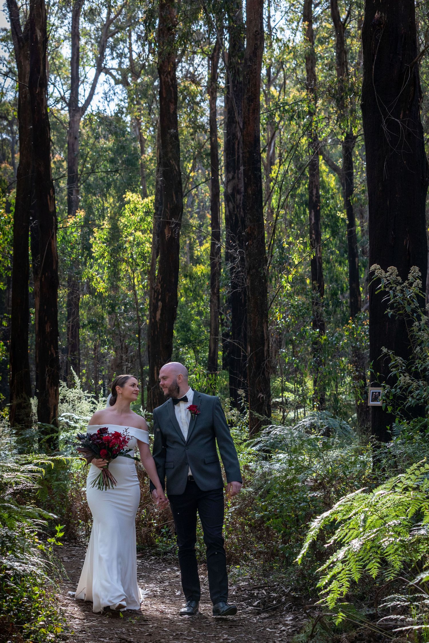 Bride and Groom walking in forest. Leigh Ball Photography. Macedon Ranges