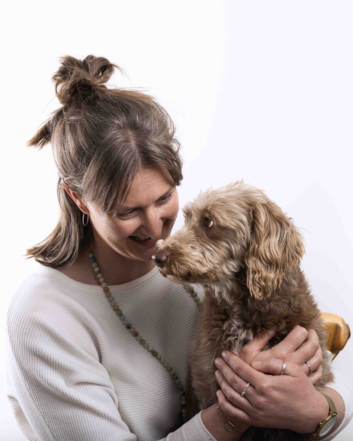 Woman and her dog looking at one another