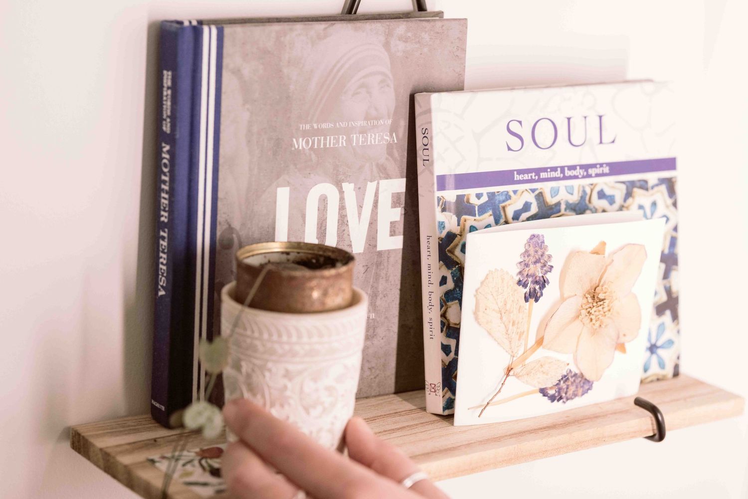 collection of books and plant in yoga studio