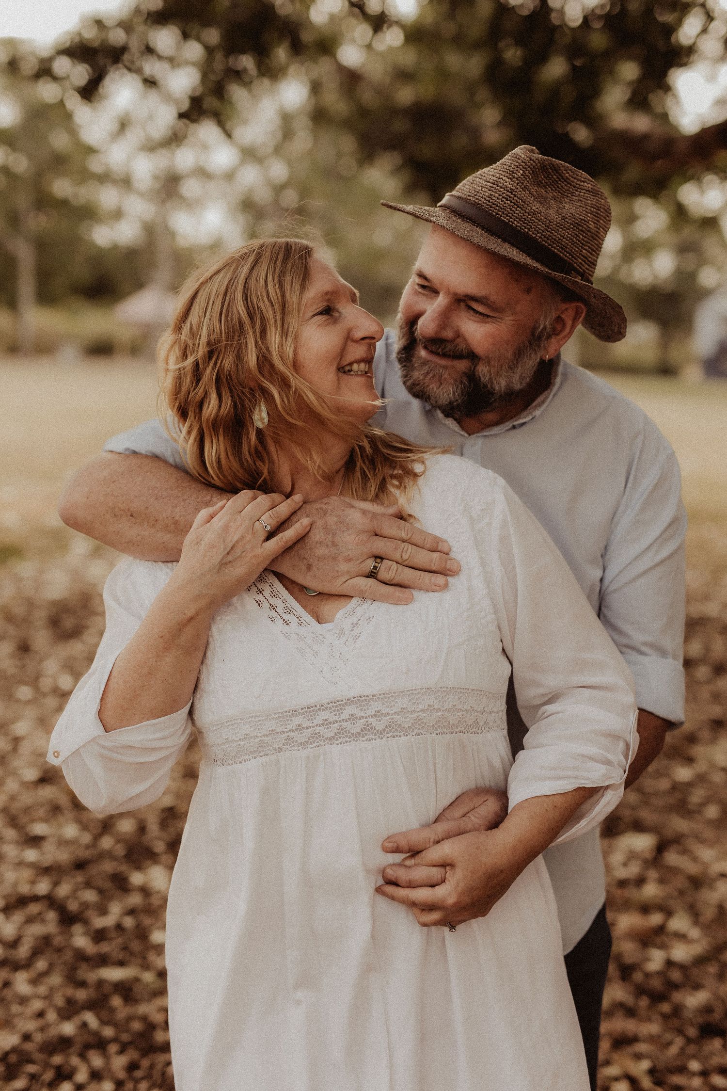 Woman and Man embracing in park