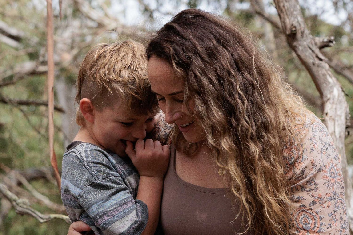 Mum and son share a secret.  Leigh Ball documentary family photographer