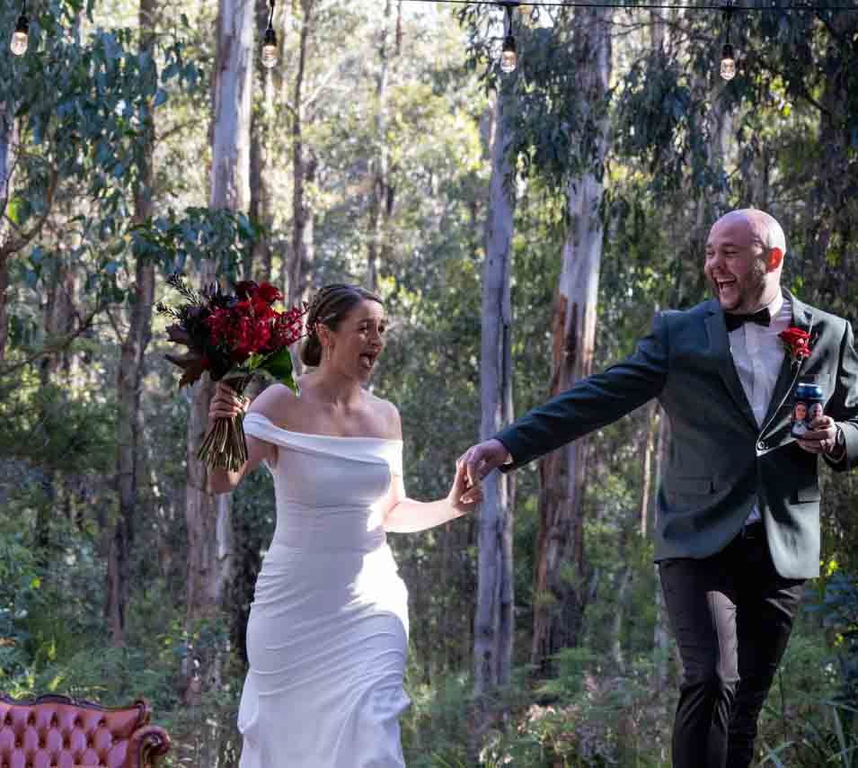 Bride and Groom running together and laughing.  Leigh Ball Documentary Wedding Photographer