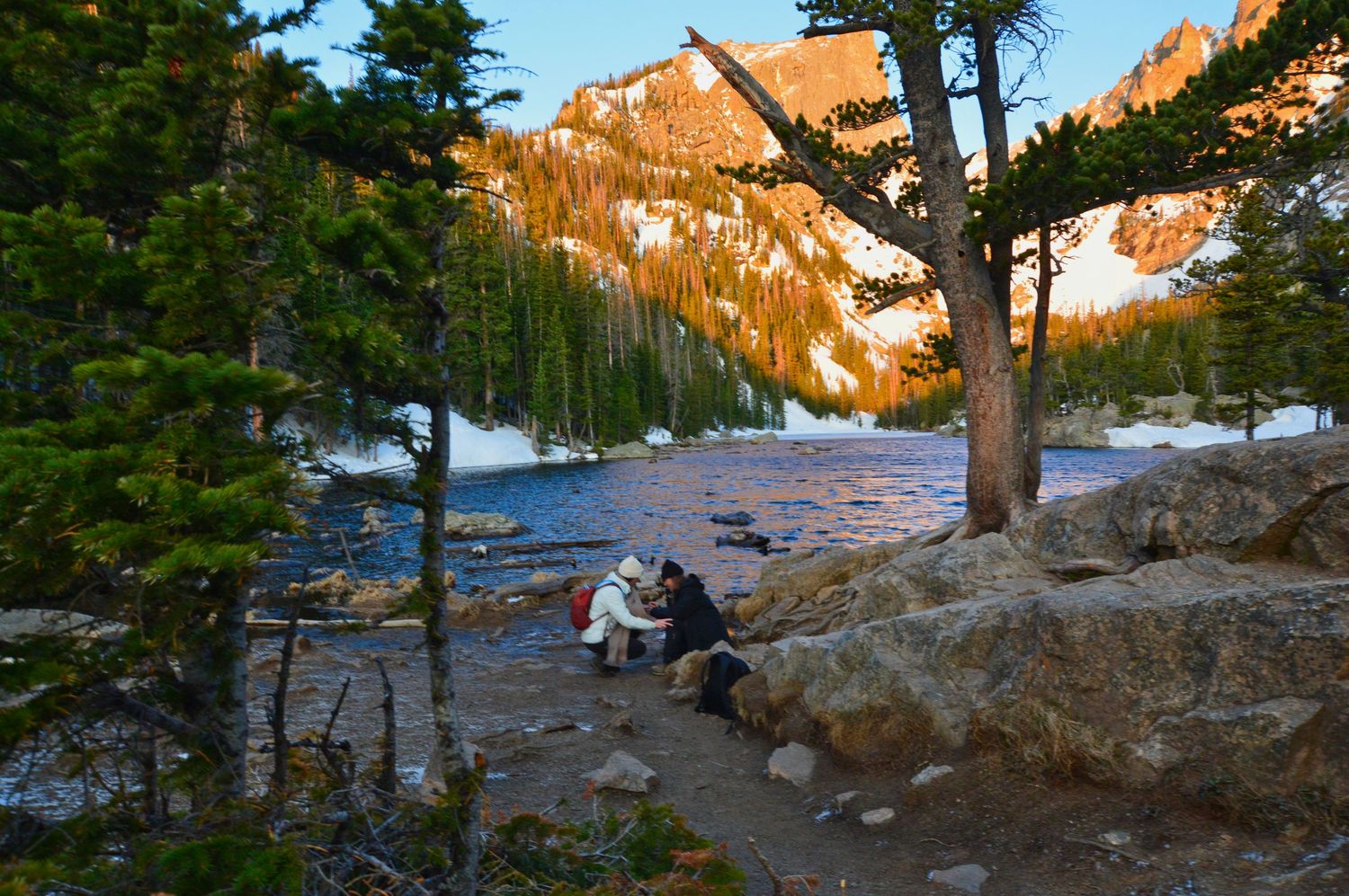 She fell to the ground to be on her level after she proposed at Dream Lake.  Pixcapades | The Rocky Mountain Proposal Photographer