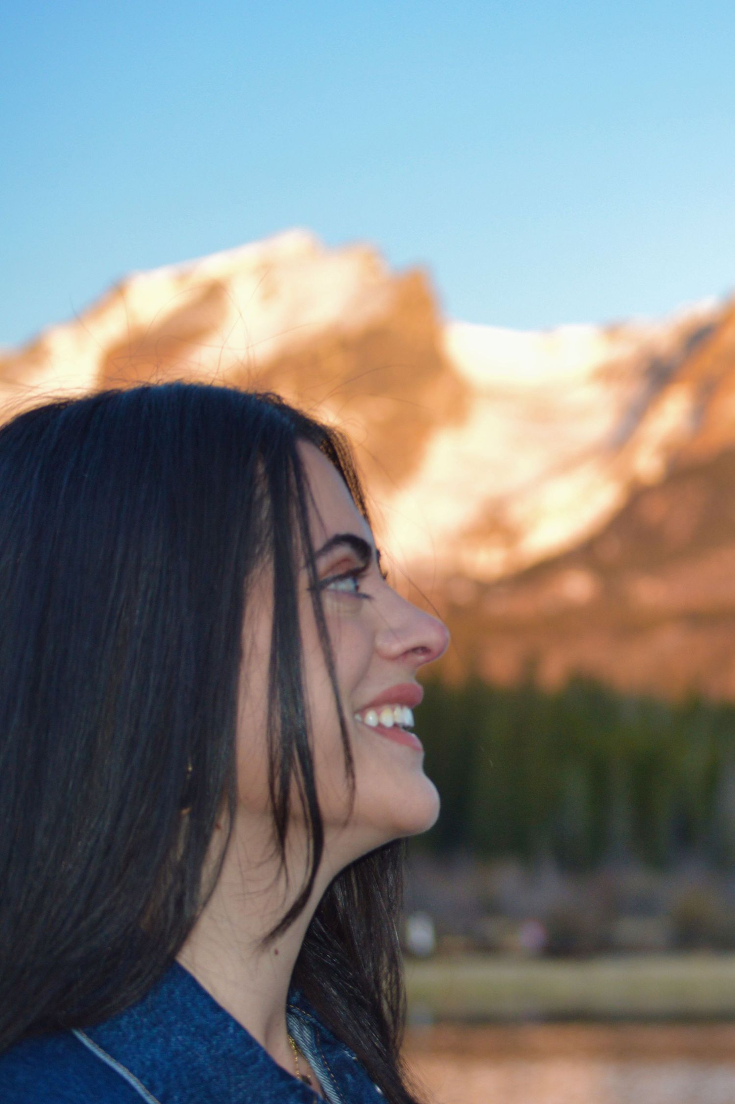Only the woman, she is staring at her now fiancé after he proposed at Sprague Lake. Photographer: Pixcapades