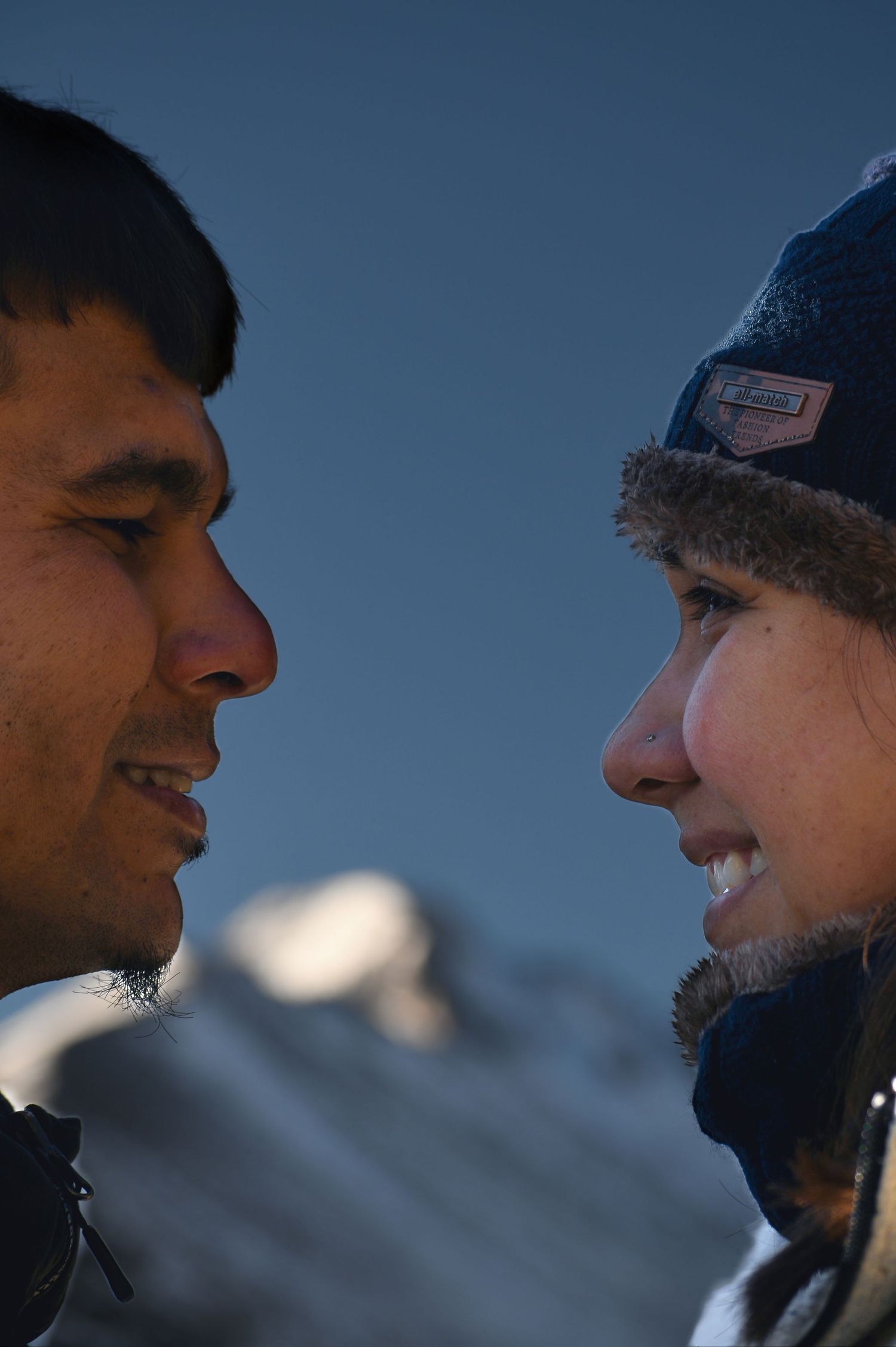 She smiles back at him full of joy after he just proposed to her. Pixcapades | The Rocky Mountain Proposal Photographer