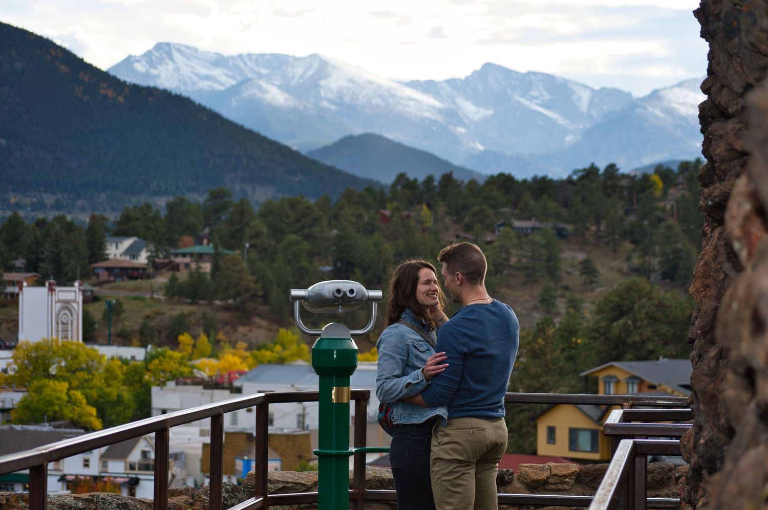 He tucks her hair behind her ear after she just said yes to his proposal in Estes Park Colorado. Photographer: Pixcapades