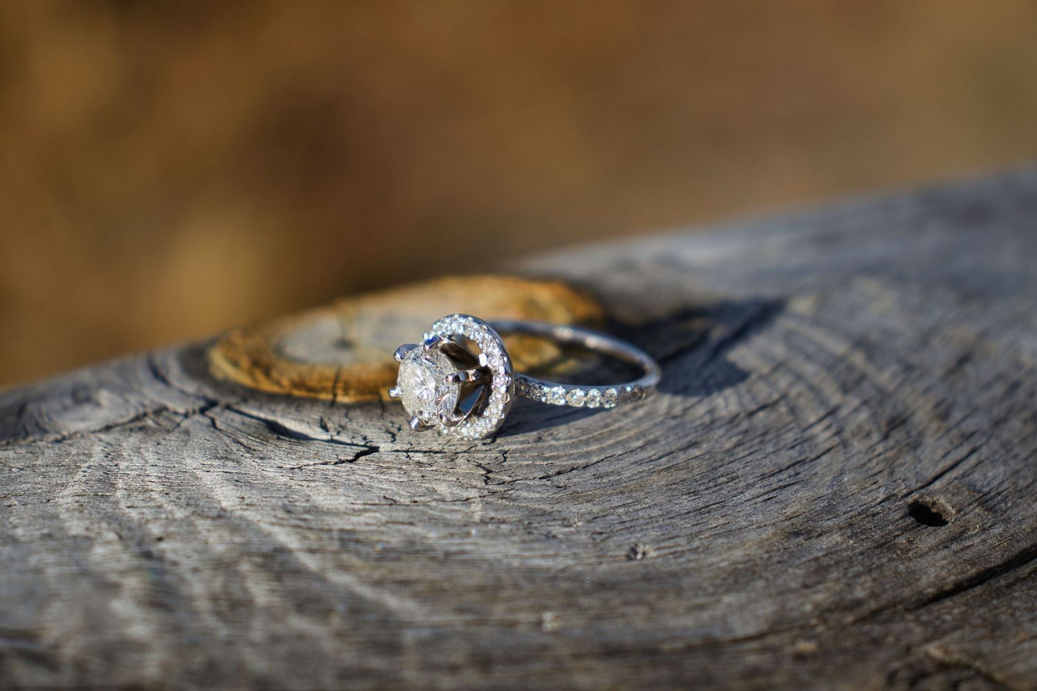 Engagement ring on the railing of the dock at Sprague Lake in Rocky Mountain National Park