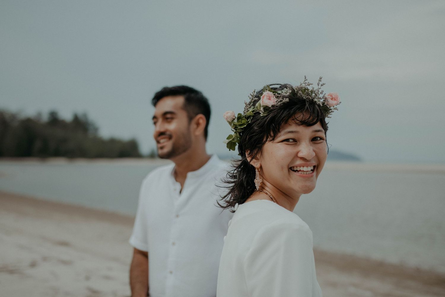 Malay couple portrait having fun at a wedding at Balok beach, Pahang