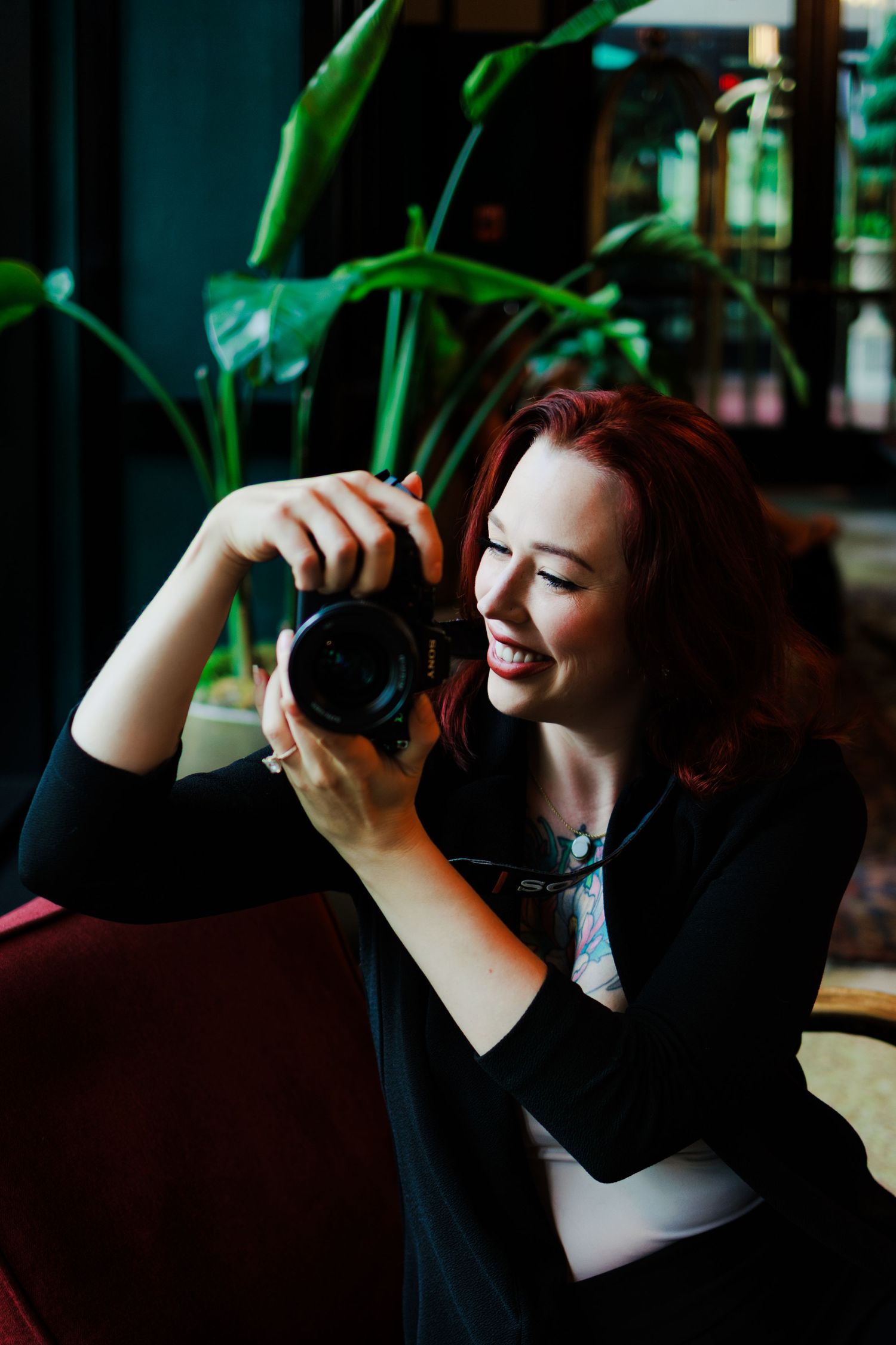 New Orleans Birth Photographer Autumn Hutton holding camera during a headshot/branding session