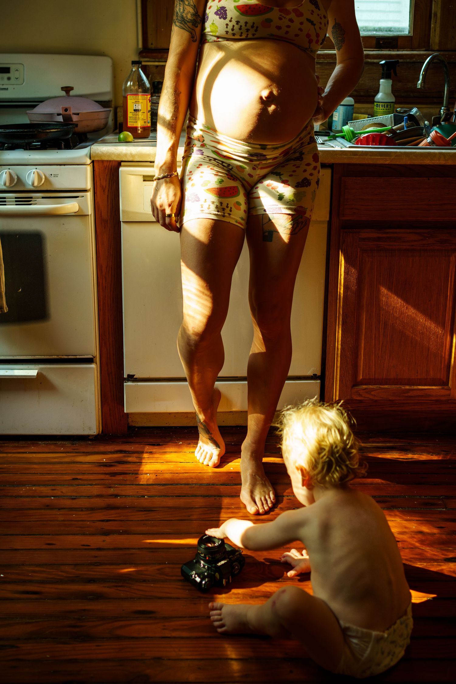 A series of photos showing feet on a wooden floor with dramatic sunlight streaming through a window.