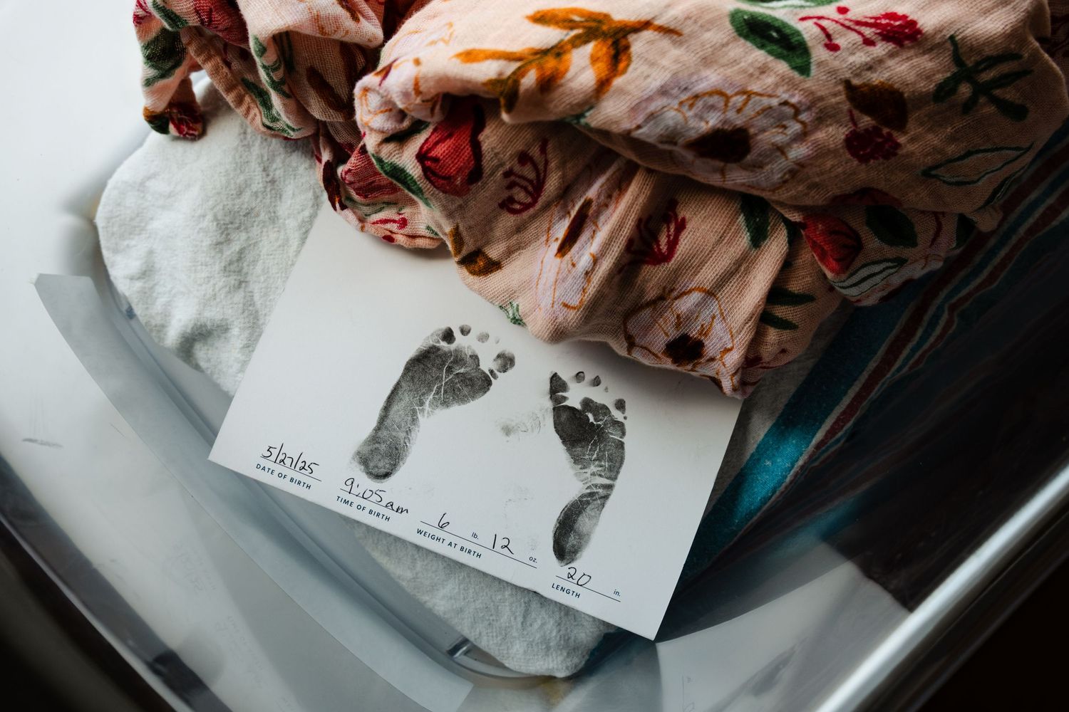 A floral fabric or clothing item appears to be carefully folded with a paper tag attached.