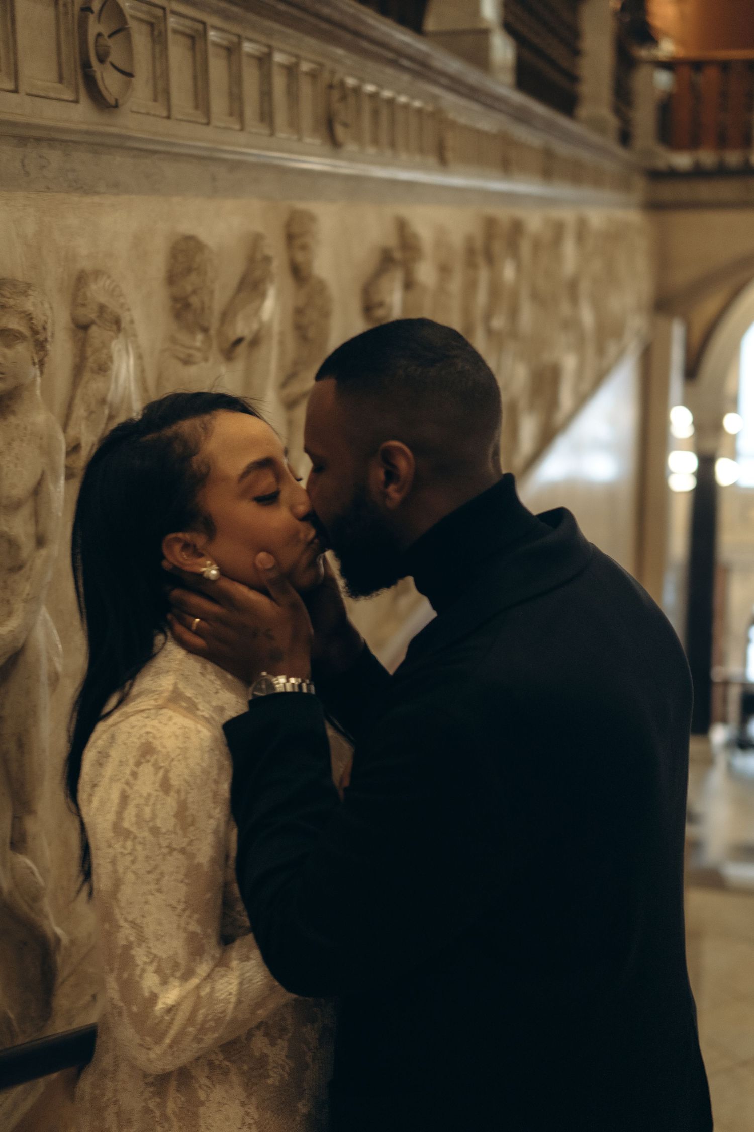 groom kissing his bride in National Museum in Stockholm during cinematic wedding photoshoot