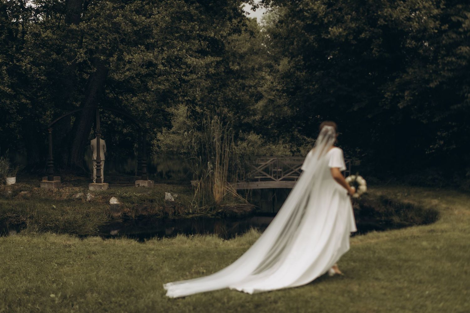 bride approaching her groom during first look while being captured by wedding photographer in Uppsala