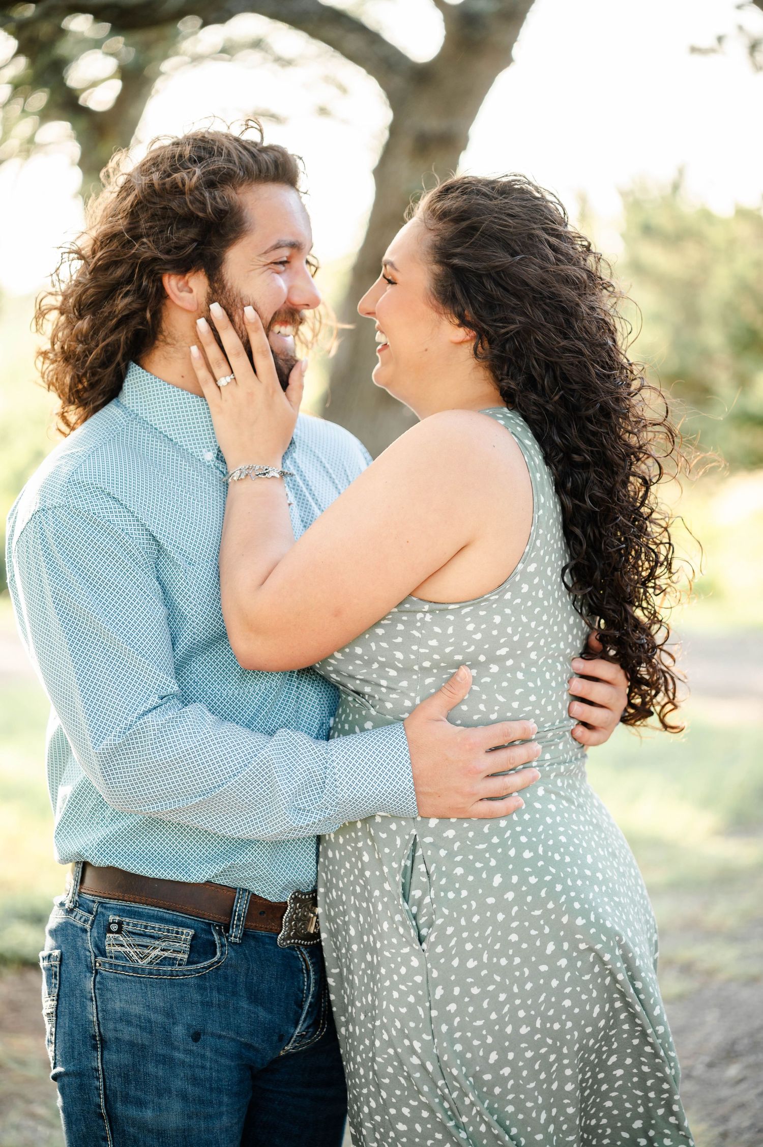 a woman touches her man's face gently