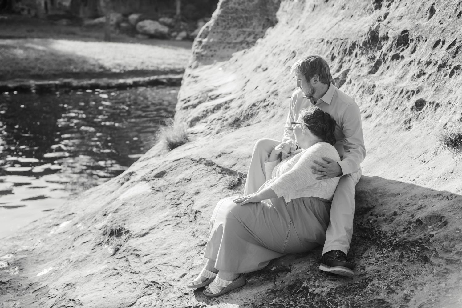A couple sitting together at Tonkawa Falls in Crawford, Texas