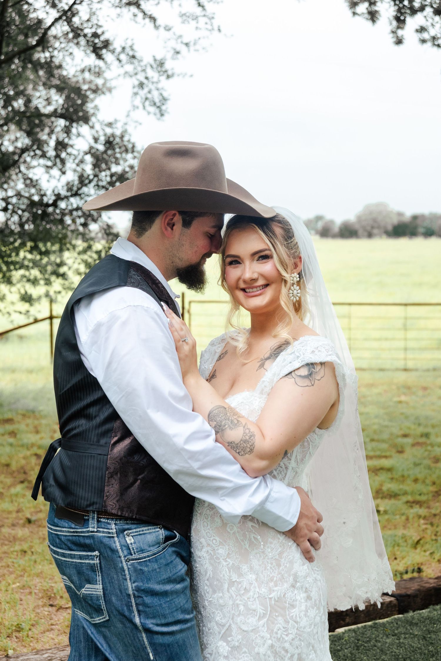 A bride and groom pose for a portrait