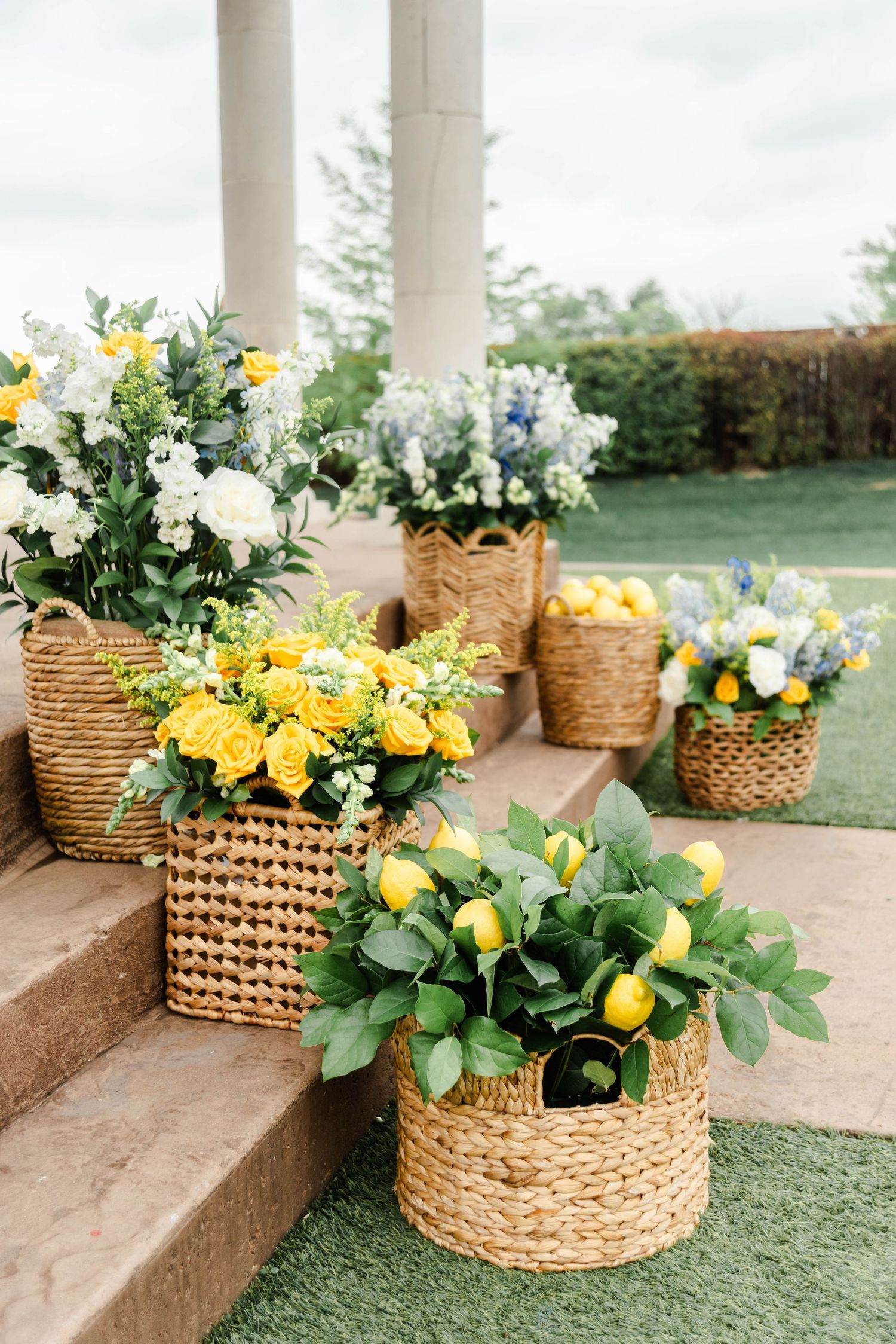ceremony set up featuring blue and yellow flowers and lemons