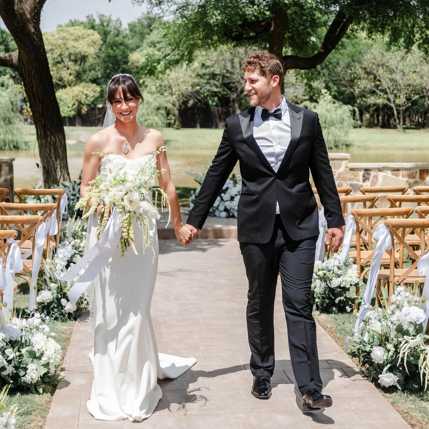 couple walking together at ceremony site