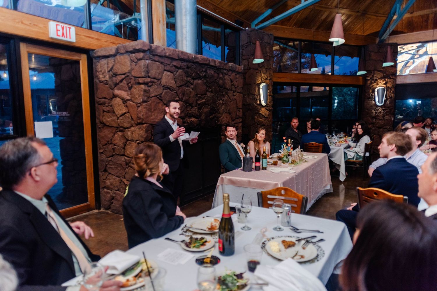 a best man gives a speech to the couple