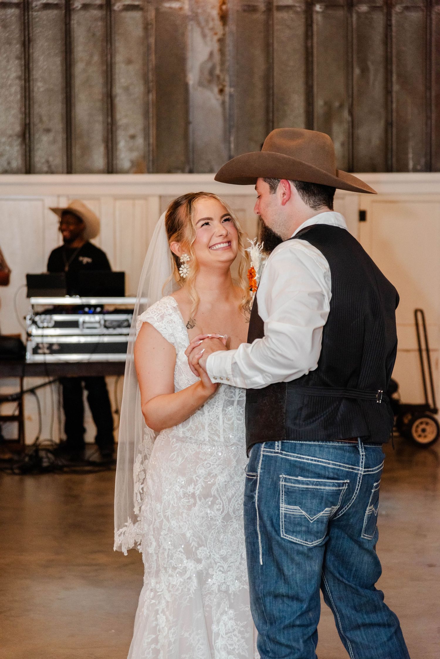 a couple dances in wedding attire