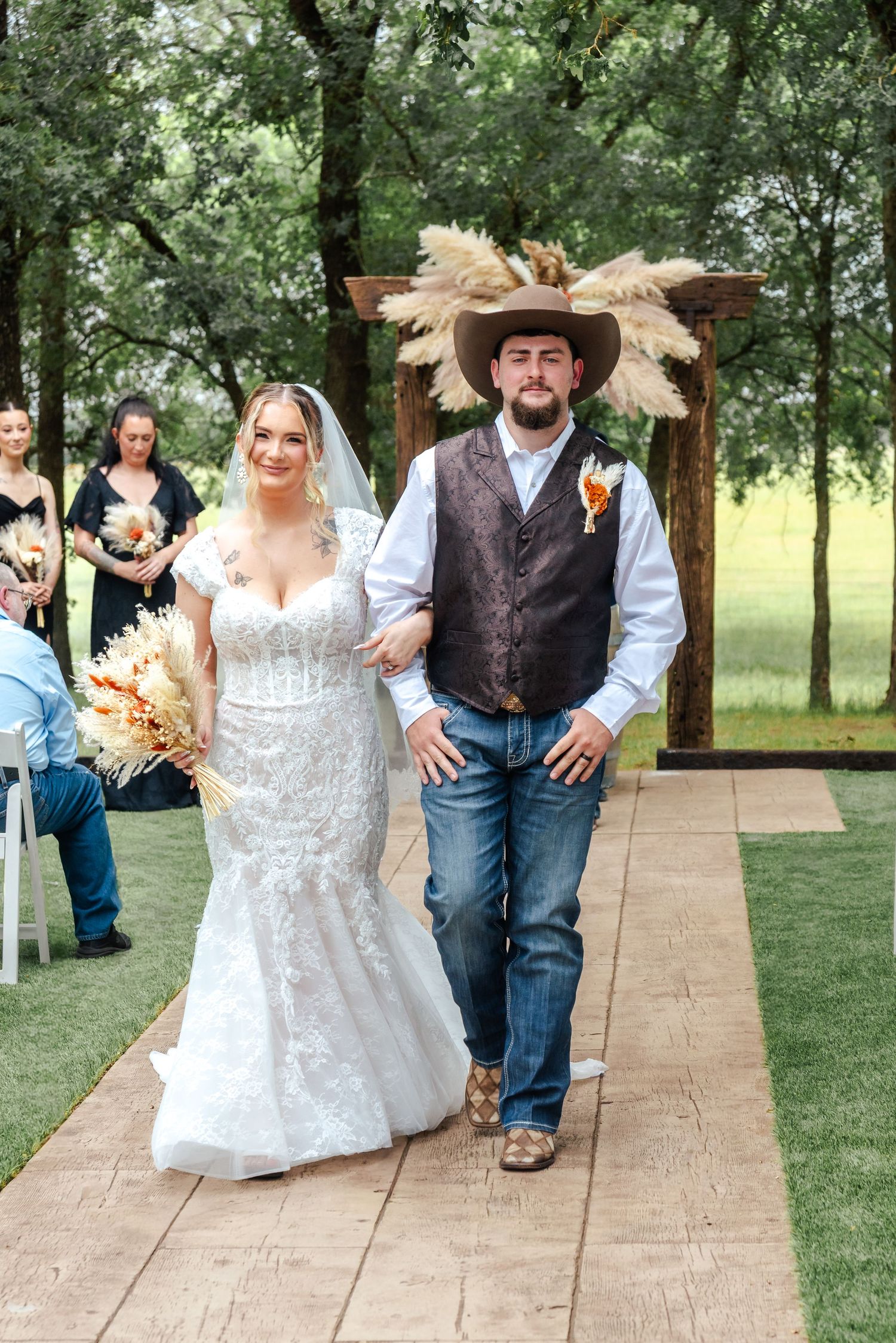 A couple walks back down the aisle after saying their vows.