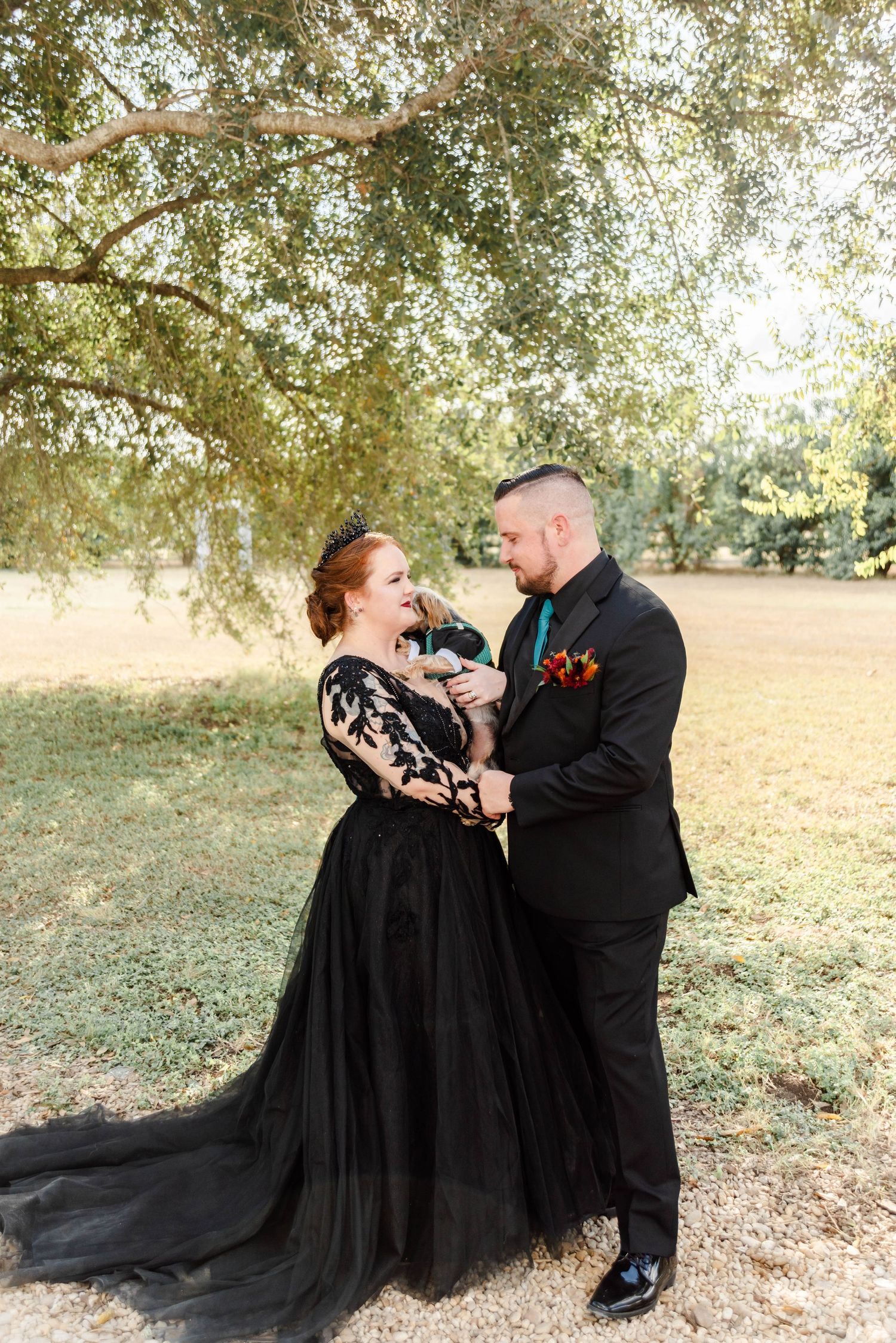 Couple posing with their dog