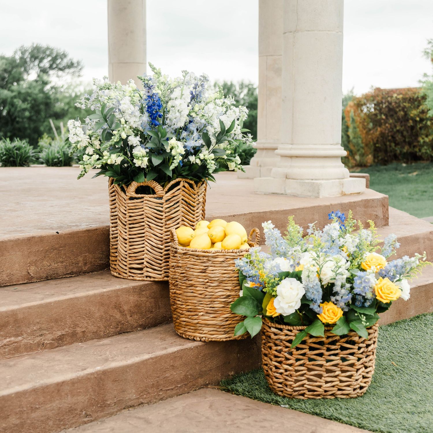 ceremony set up featuring blue and yellow flowers and lemons