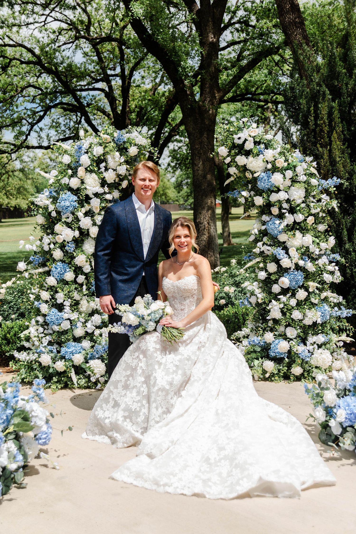couples at the ceremony site with the florals