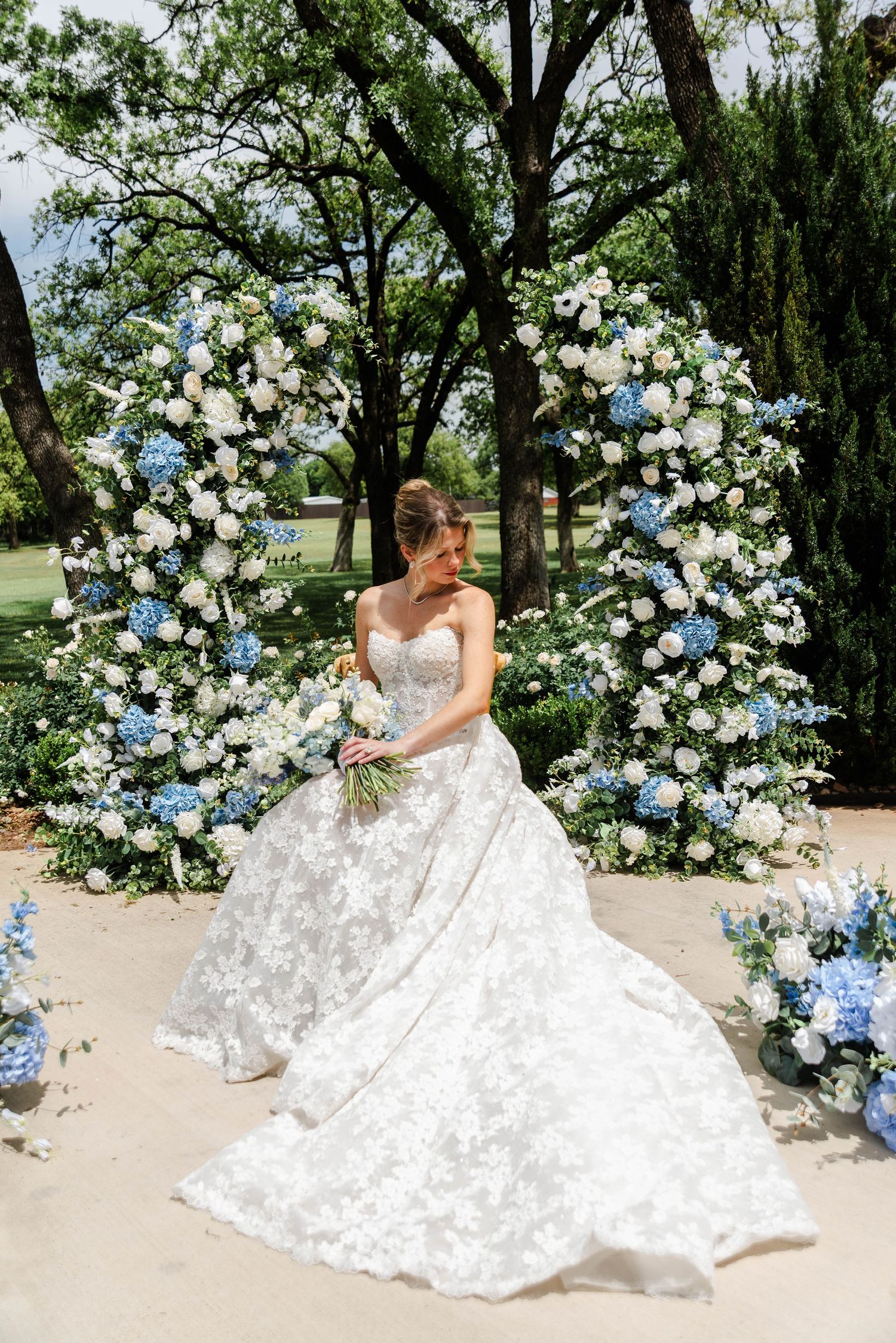 bride at the ceremony site with the florals