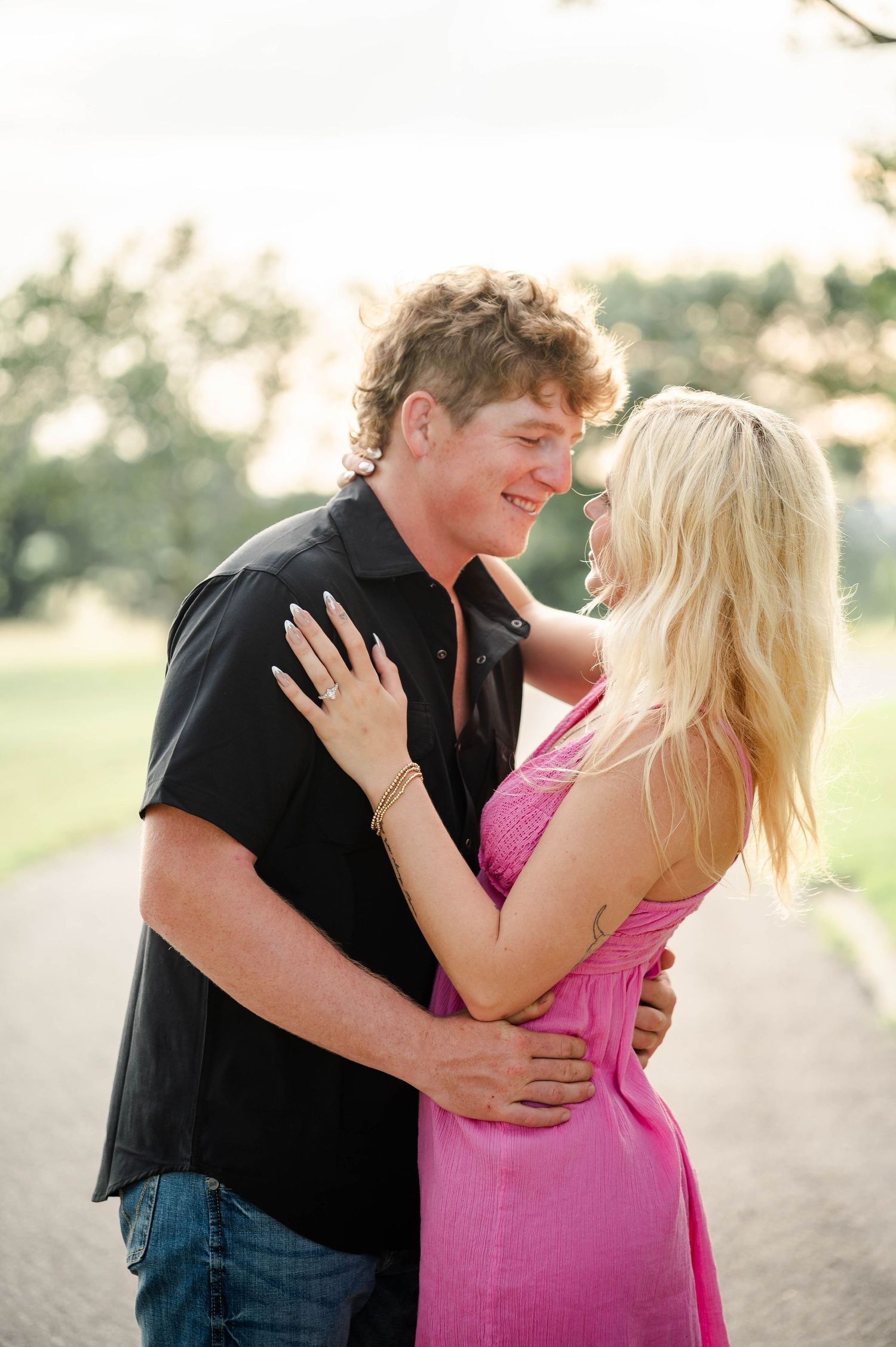 a couple embraces gently while looking at each other