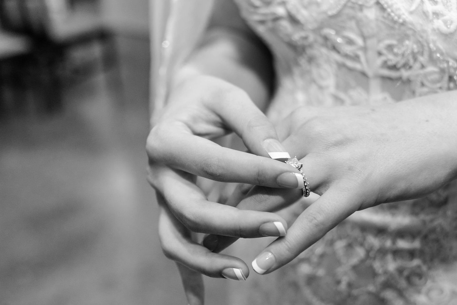 A bride adjusts her wedding ring