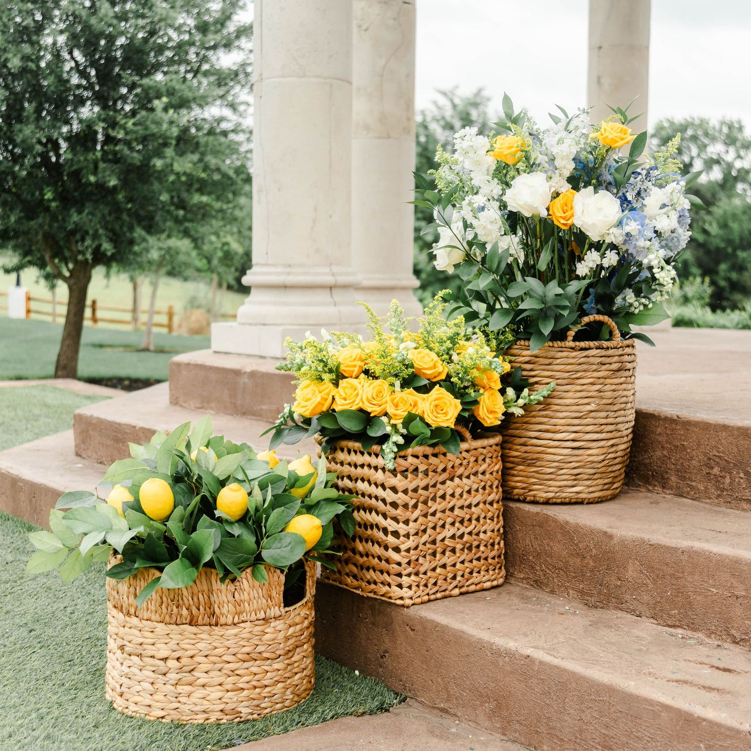 ceremony set up featuring blue and yellow flowers and lemons